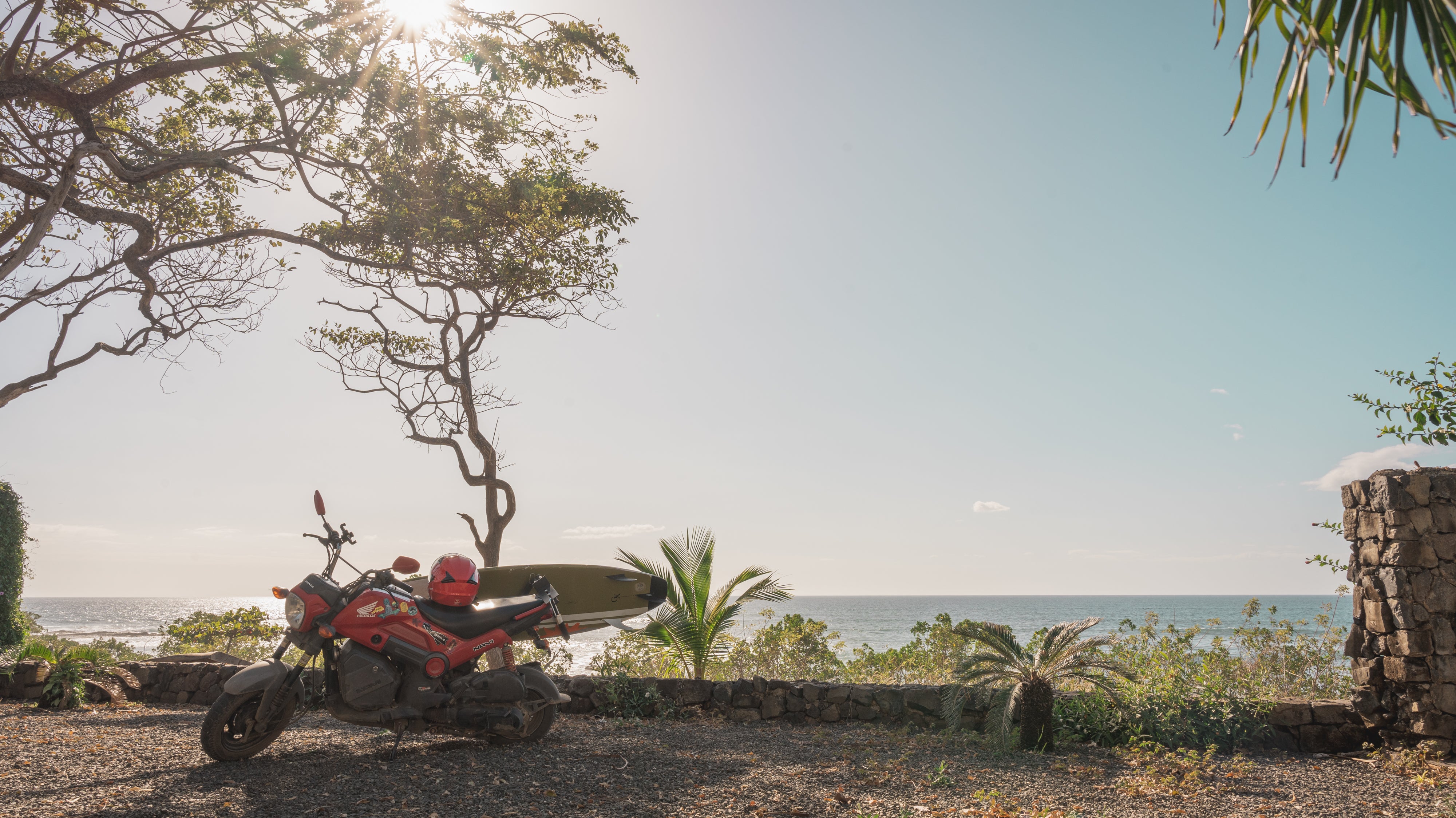 Honda Navi scooter with surf rack near the beach in Tamarindo