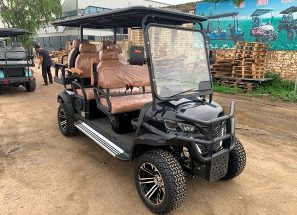 Golf cart on a dirt road with a colorful mural in the background